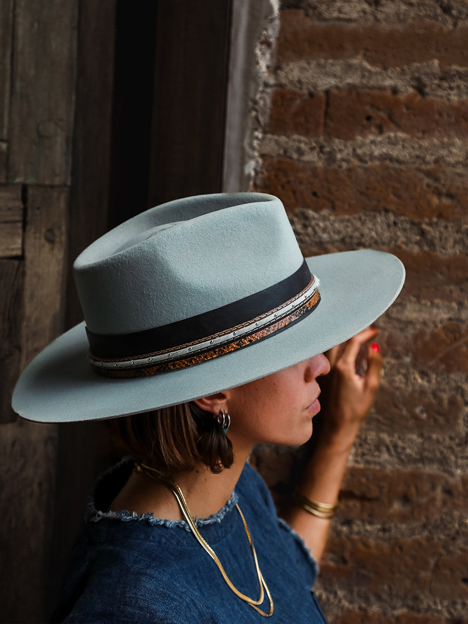 H0002 - DISTRESSED AQUA HEART AND WINGS ON CROWN COWGIRL HAT WITH BROWN LEATHER CROSSPIECE AND PYTHON PRINT HATBAND